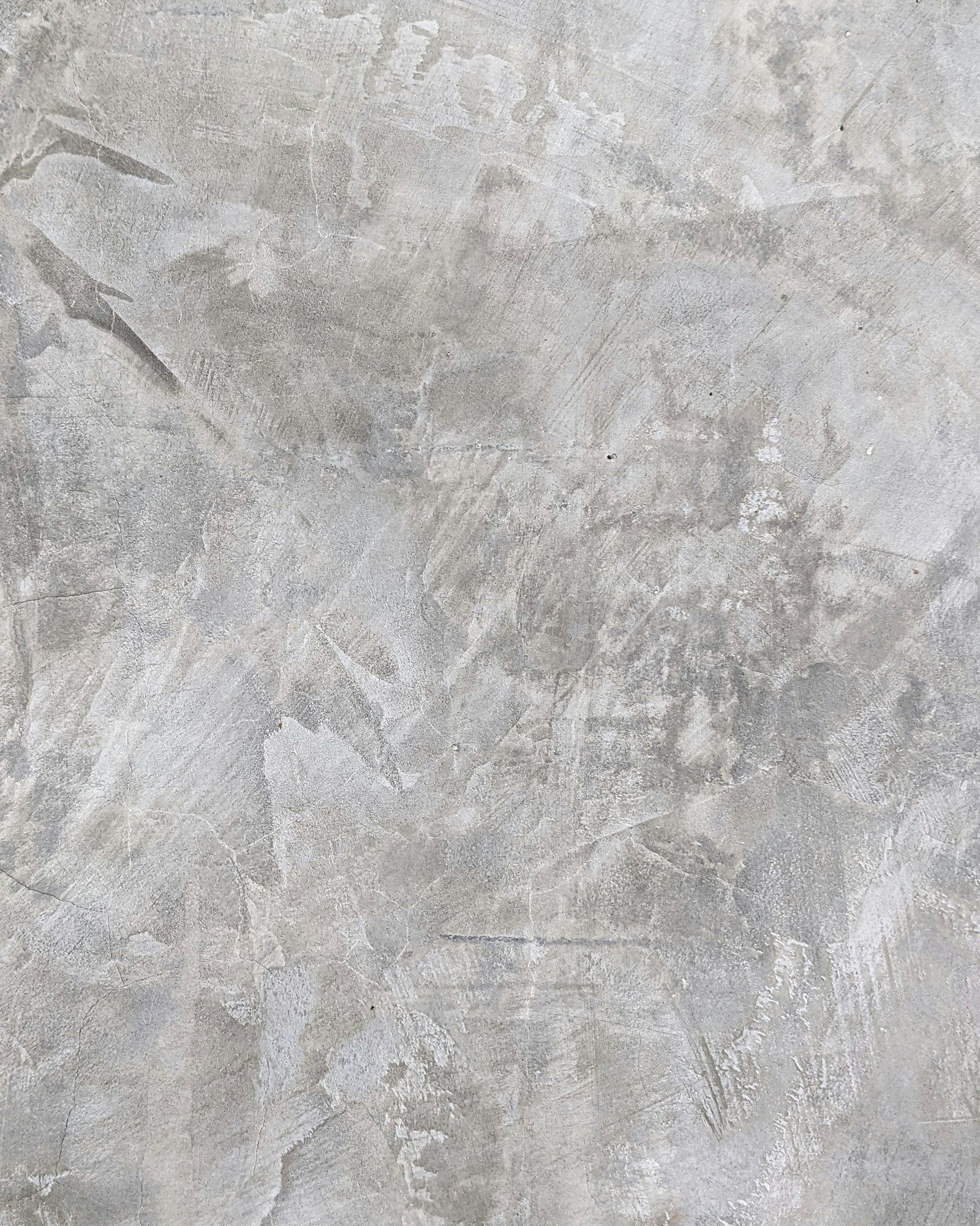 Detail: Betonoptik-Oberfläche, Grau, mit sichtbaren Spachtelspuren